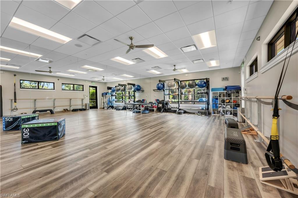 1671 Vinland Way Naples, FL 34105 - Photo 46 of 50 a view of a room with lots of wooden furniture and windows