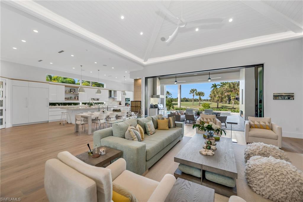 1671 Vinland Way Naples, FL 34105 - Photo 5 of 50 a living room with furniture and a large window