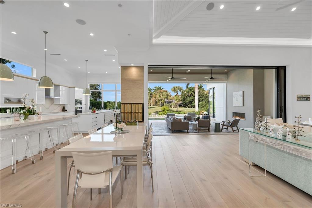 1671 Vinland Way Naples, FL 34105 - Photo 7 of 50 a large kitchen with a table and chairs