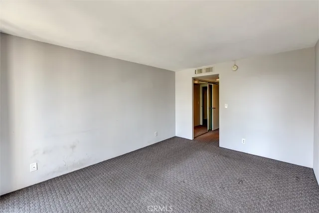 a view of an empty room and window