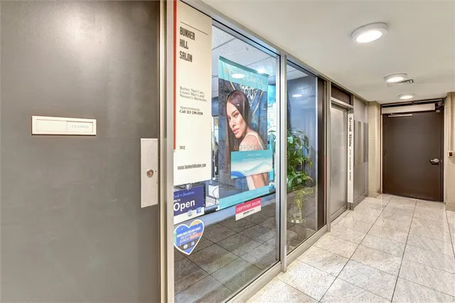 a view of a hallway with bathroom