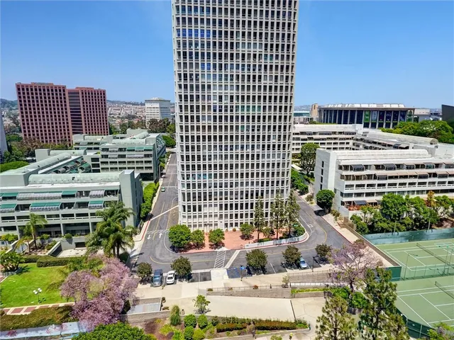 an aerial view of a house with a yard basket ball court and outdoor seating