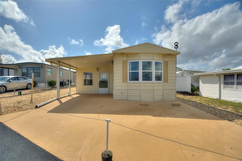 251 Patterson Road, Unit G9 Haines City, FL 33844 - Photo 1 of 40 a view of a house with a street