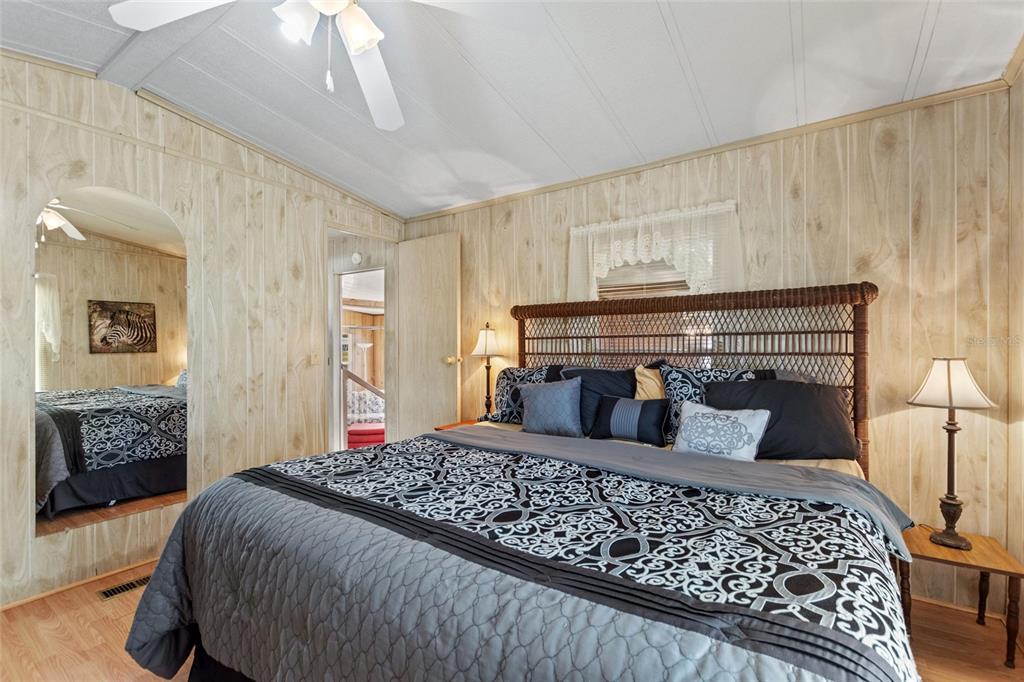 251 Patterson Road, Unit G9 Haines City, FL 33844 - Photo 20 of 40 a bedroom with a large bed and a couch