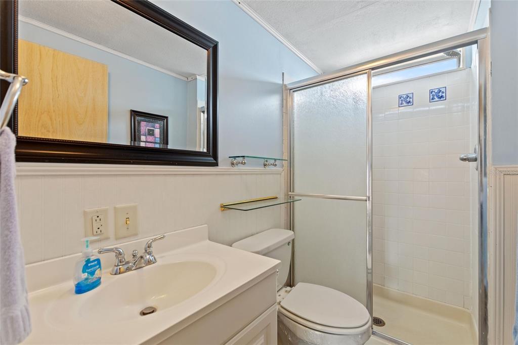 251 Patterson Road, Unit G9 Haines City, FL 33844 - Photo 22 of 40 a bathroom with a sink mirror vanity and toilet