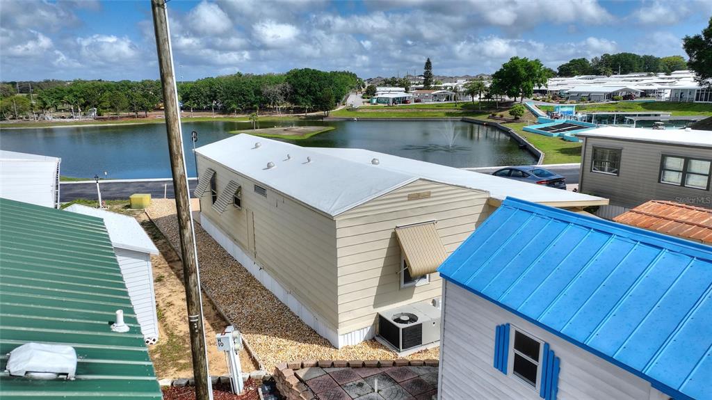 251 Patterson Road, Unit G9 Haines City, FL 33844 - Photo 30 of 40 a view of a lake with a deck
