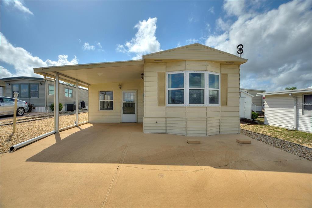 251 Patterson Road, Unit G9 Haines City, FL 33844 - Photo 3 of 40 a front view of a house with a garage