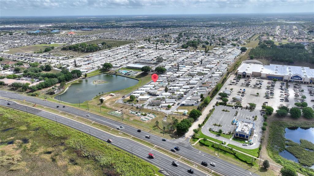 251 Patterson Road, Unit G9 Haines City, FL 33844 - Photo 34 of 40 an aerial view of residential houses with outdoor space