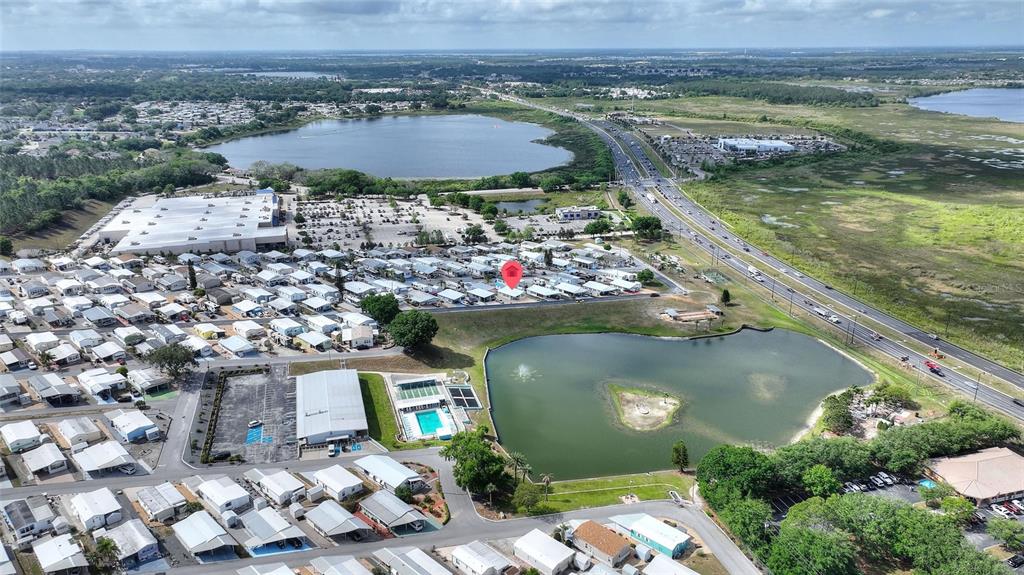 251 Patterson Road, Unit G9 Haines City, FL 33844 - Photo 39 of 40 an aerial view of a house with a garden and lake view