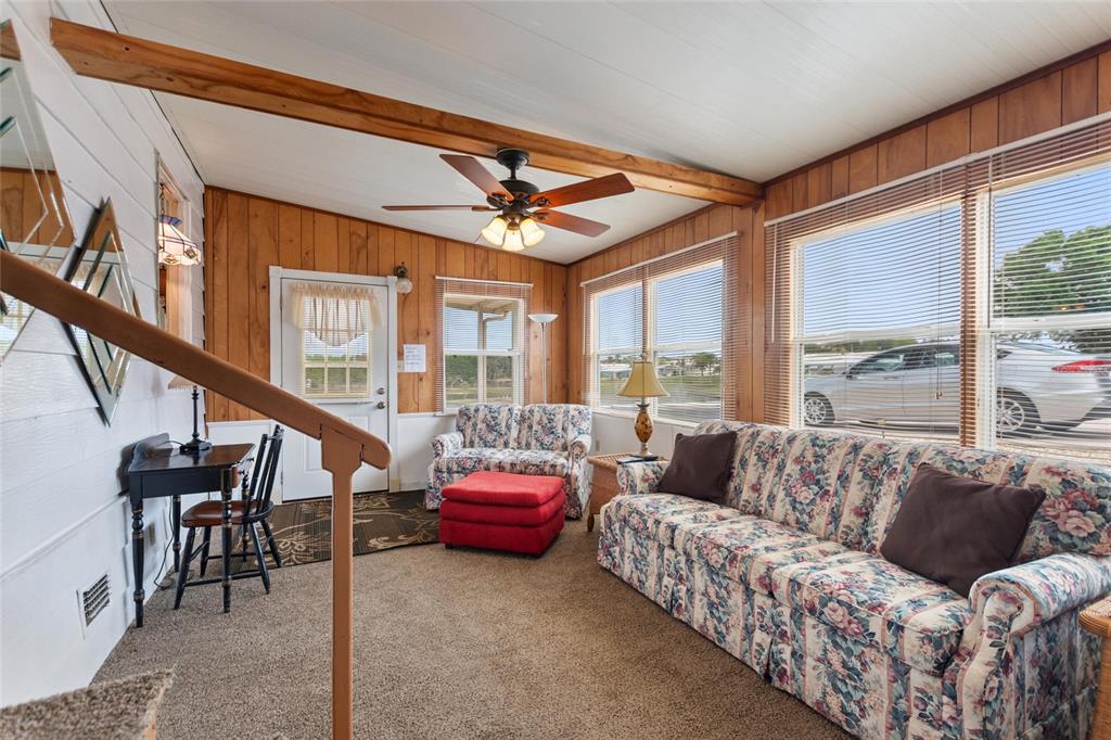 251 Patterson Road, Unit G9 Haines City, FL 33844 - Photo 6 of 40 a living room with furniture and a large window