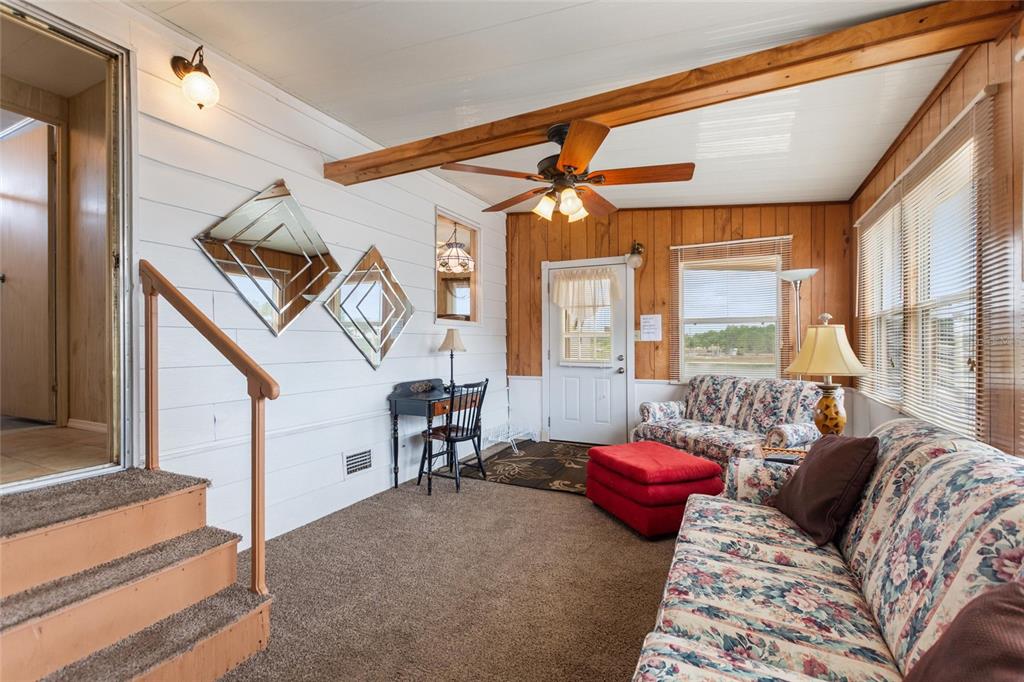 251 Patterson Road, Unit G9 Haines City, FL 33844 - Photo 8 of 40 a bedroom with furniture and a window