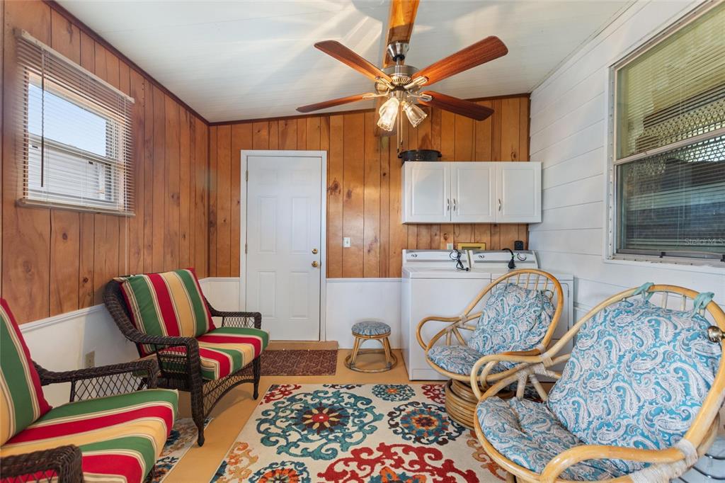 251 Patterson Road, Unit G9 Haines City, FL 33844 - Photo 9 of 40 a living room with furniture and wooden floor