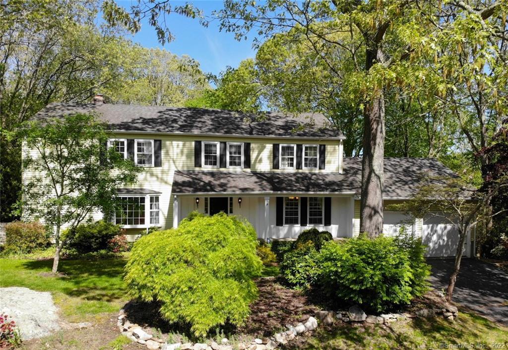 29 Trumbull Road Waterford, CT 06385 - Photo 1 of 1 a front view of a house with a yard and potted plants