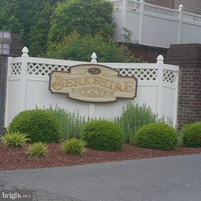 a view of a street with a building in the background