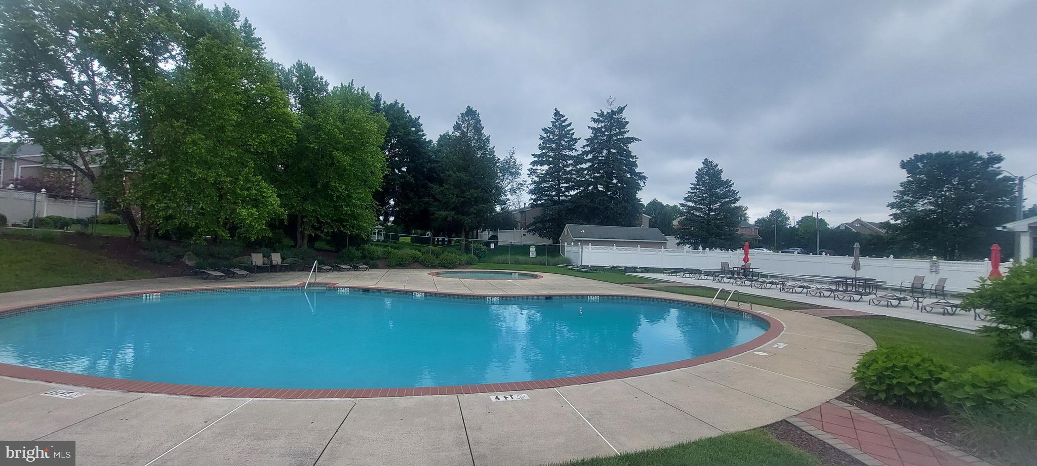 2900 State Hill Road, Unit I11 Wyomissing, PA 19610 - Photo 14 of 15 a view of a swimming pool and trees in the background