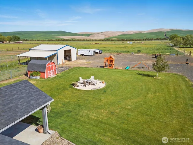 an aerial view of residential houses with outdoor space