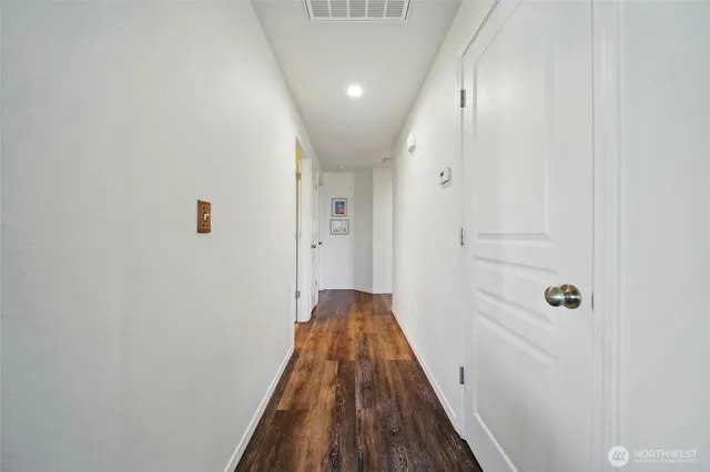 a living room with a bed furniture and a window