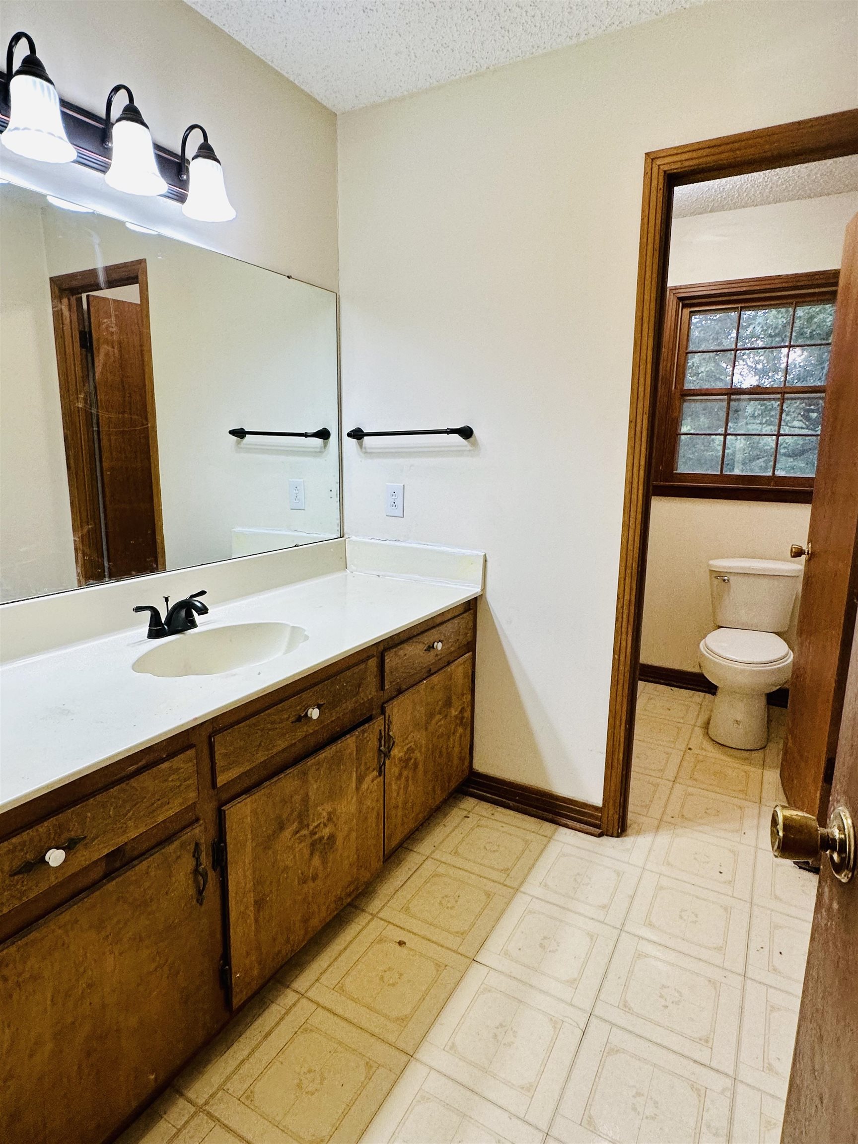 2733 New Hope Road Guys, TN 38339 - Photo 13 of 25 a spacious bathroom with a double vanity sink and a mirror