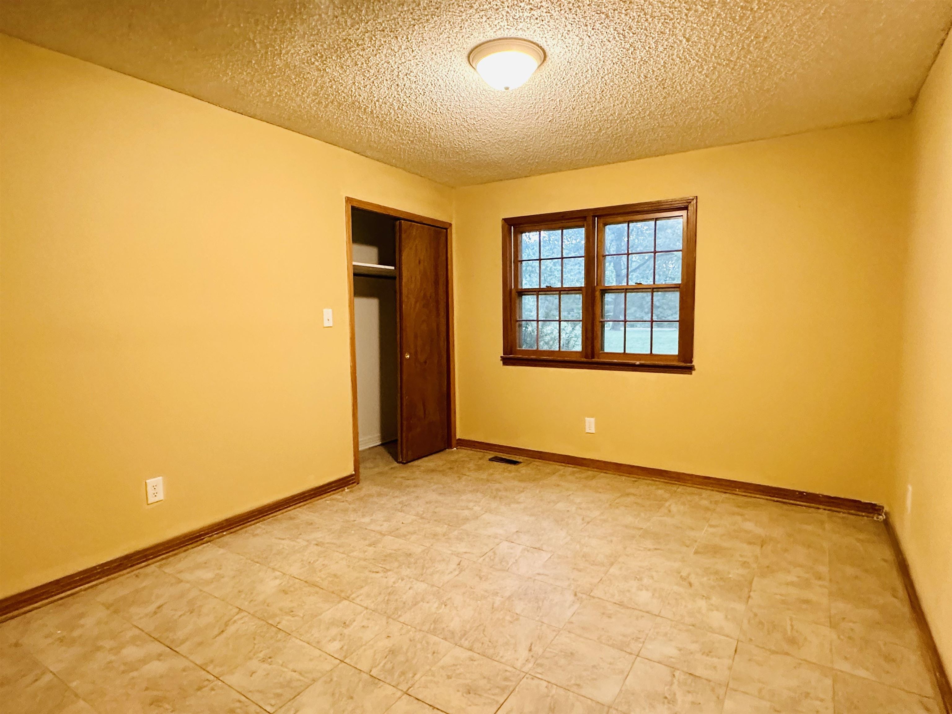 2733 New Hope Road Guys, TN 38339 - Photo 15 of 25 an empty room with a empty space and a window