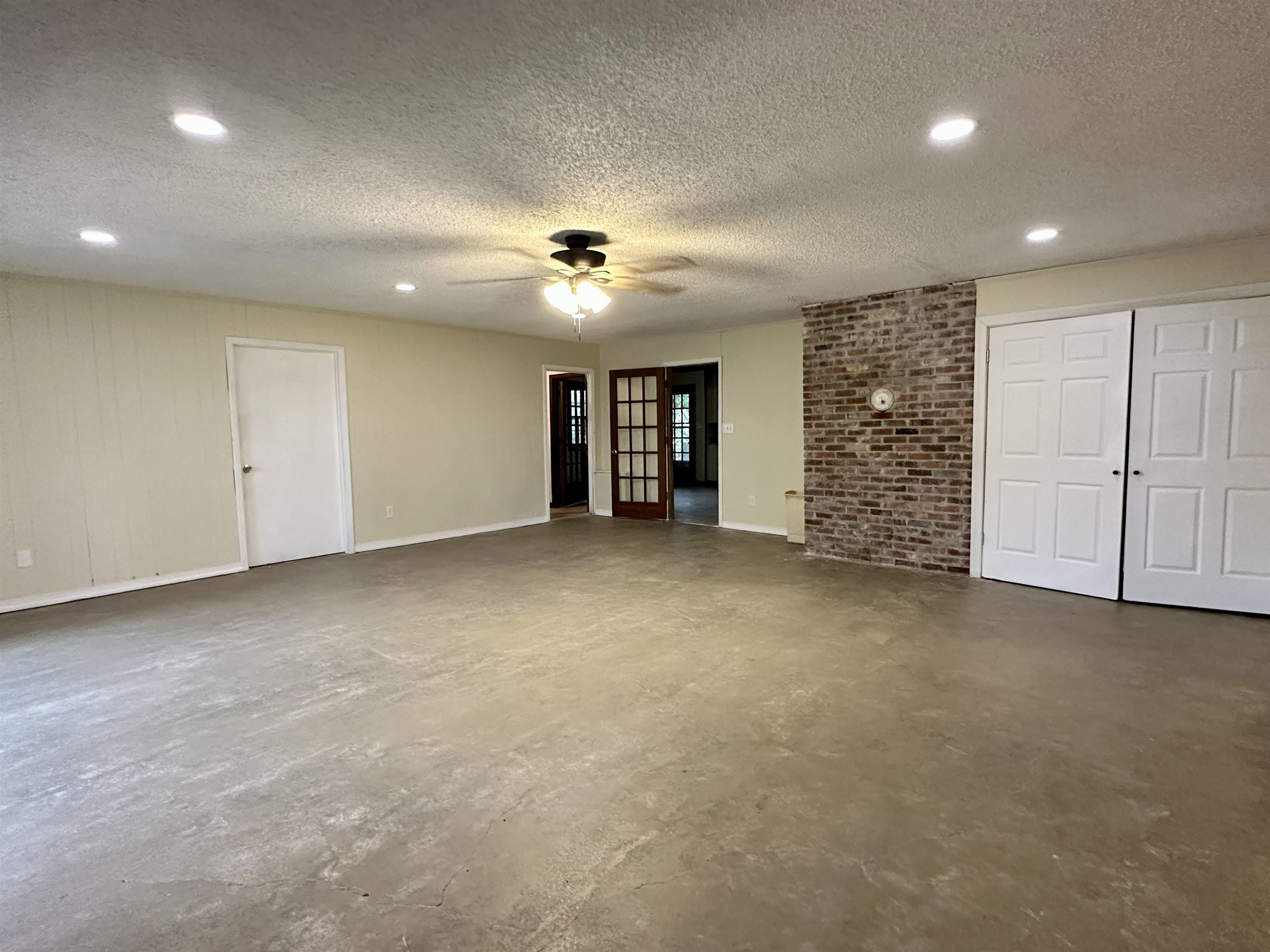 2733 New Hope Road Guys, TN 38339 - Photo 17 of 25 an empty room with windows and ceiling fan