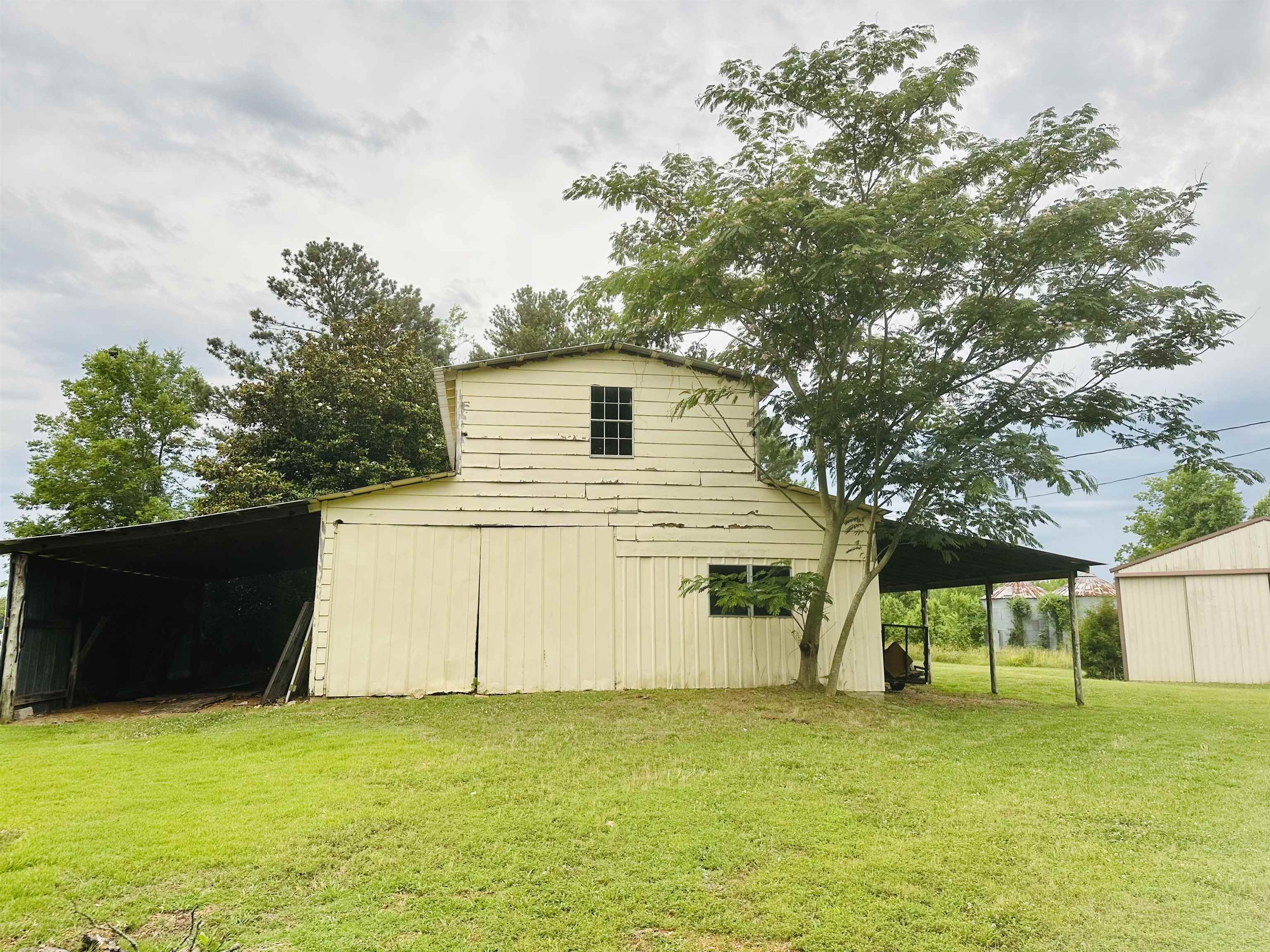 2733 New Hope Road Guys, TN 38339 - Photo 24 of 25 a house with a tree in front of it