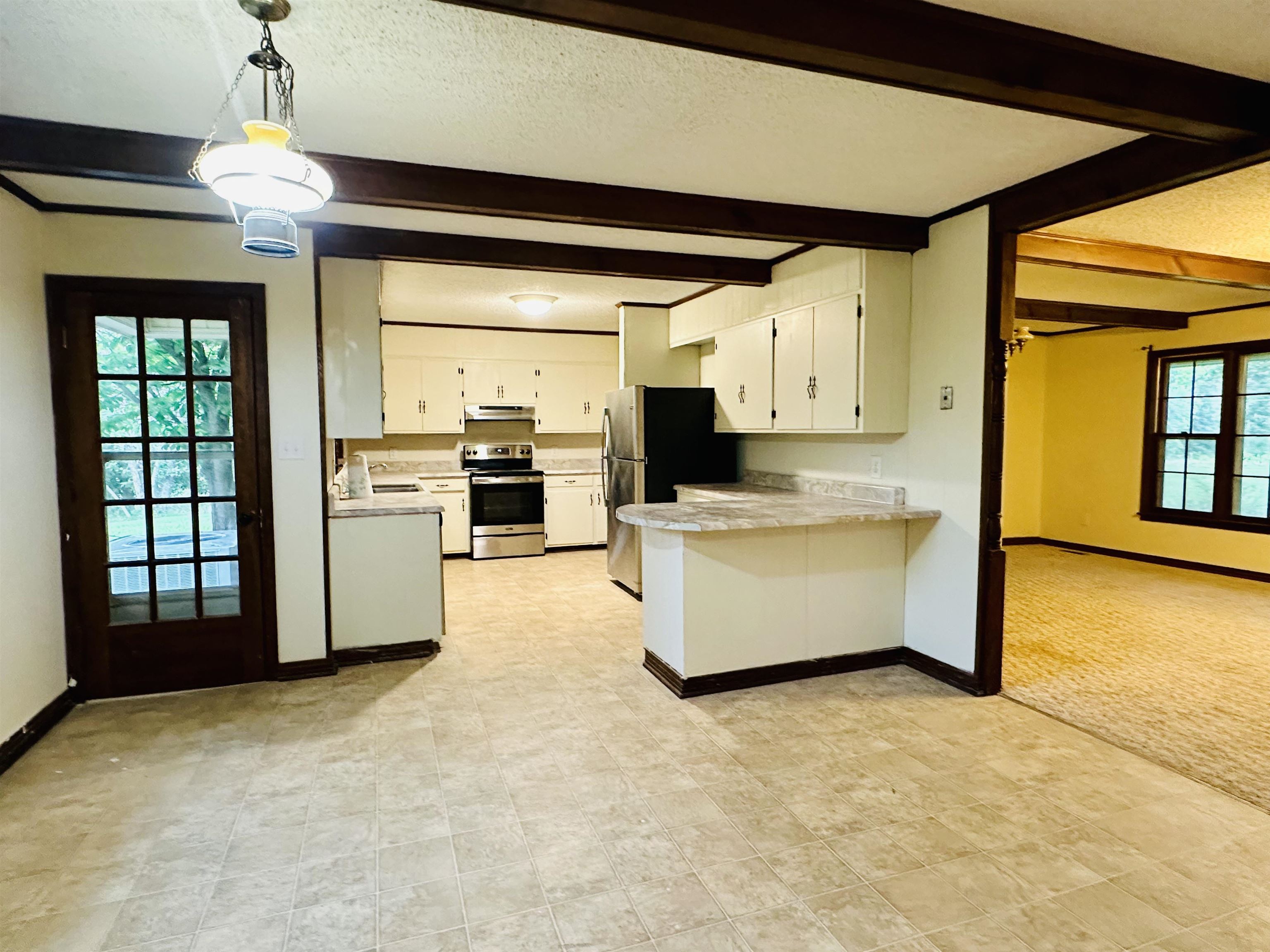 2733 New Hope Road Guys, TN 38339 - Photo 4 of 25 a large kitchen with stainless steel appliances granite countertop a stove and a refrigerator
