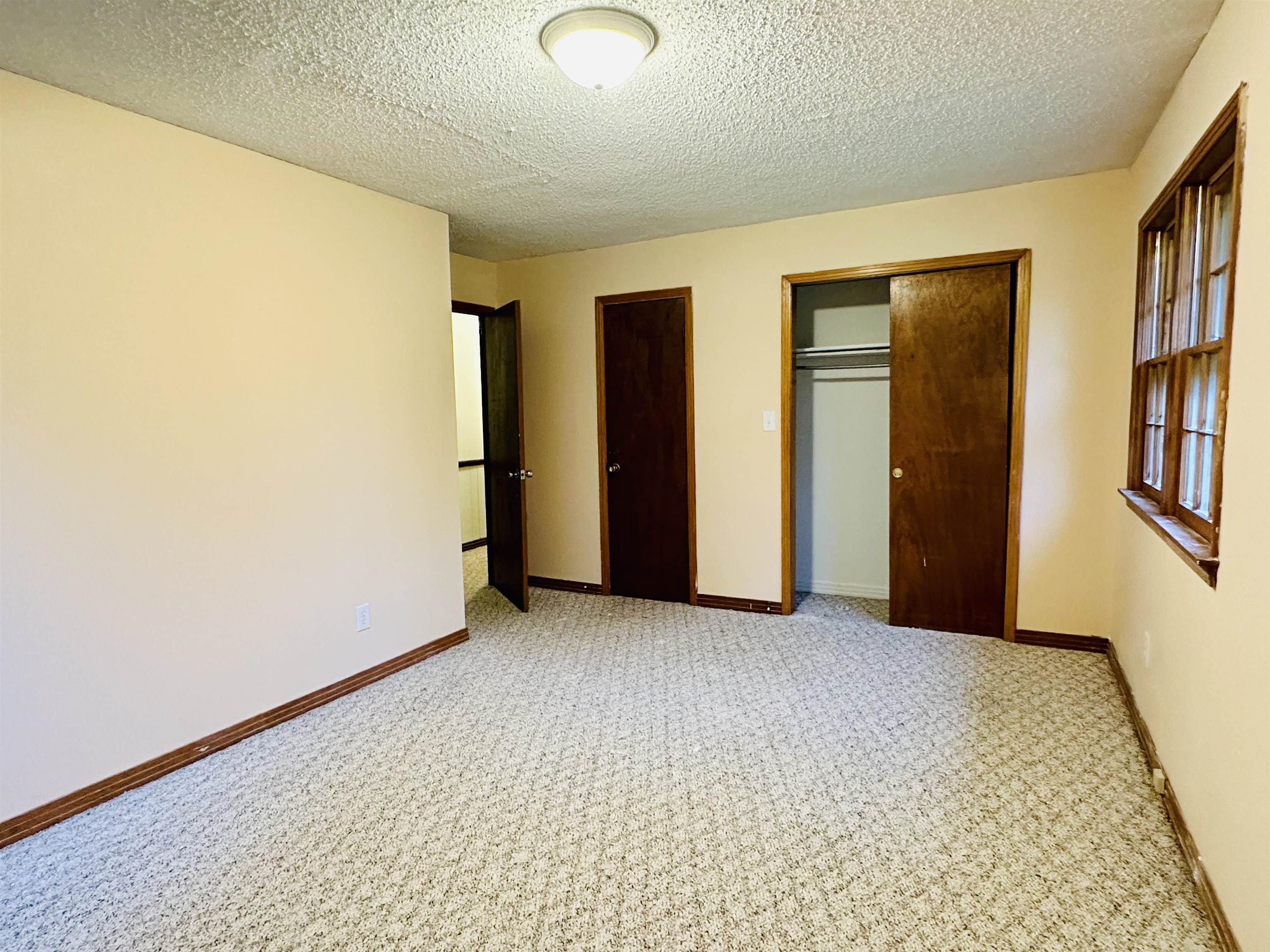 2733 New Hope Road Guys, TN 38339 - Photo 9 of 25 an empty room with closet and windows