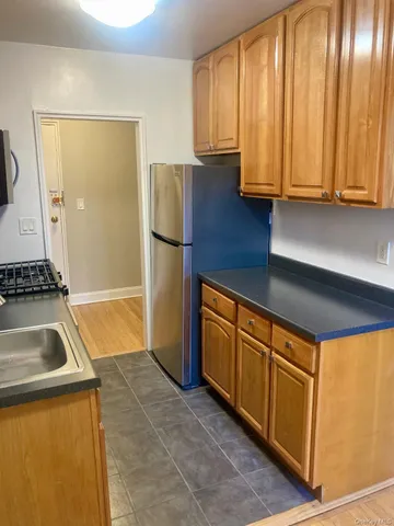 a kitchen that has a sink and a stove