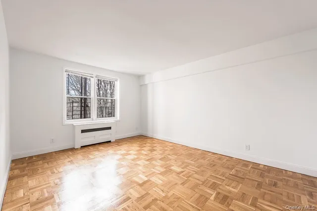a view of a kitchen with furniture and washing machine