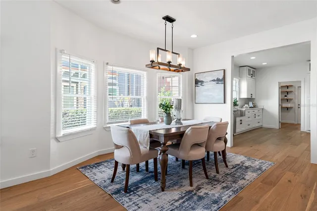 a kitchen with stainless steel appliances granite countertop a stove refrigerator sink and dishwasher