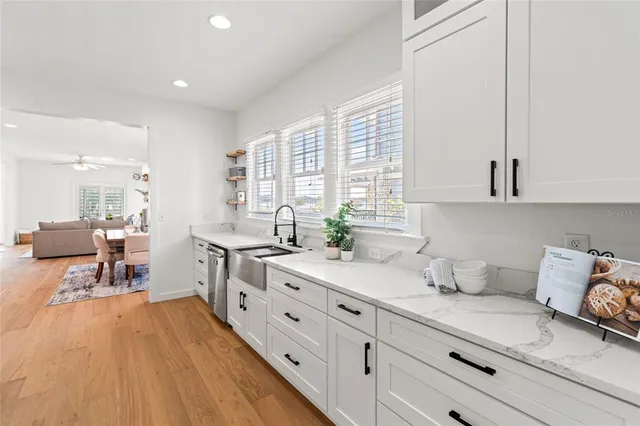 a living room with furniture a rug and a window