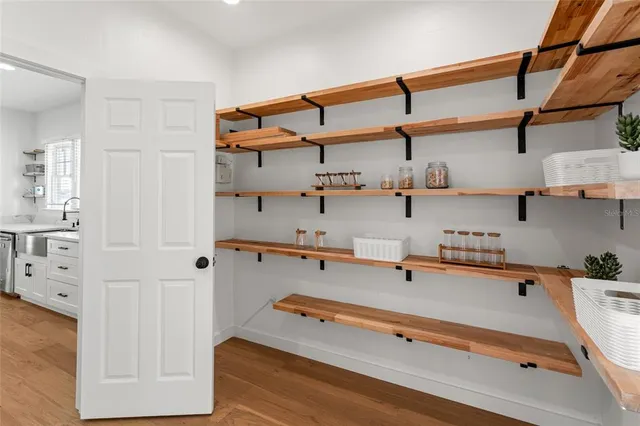 a bedroom with a large bed and a couch