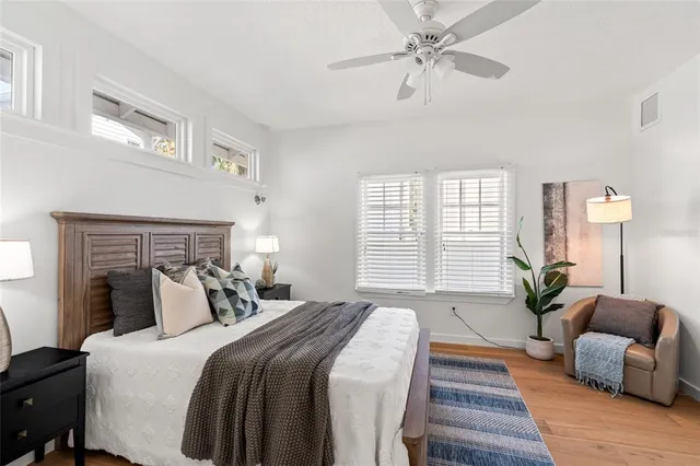 a bathroom with a sink mirror vanity and toilet