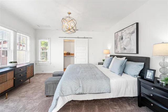 a view of a backyard with wooden bench and a table