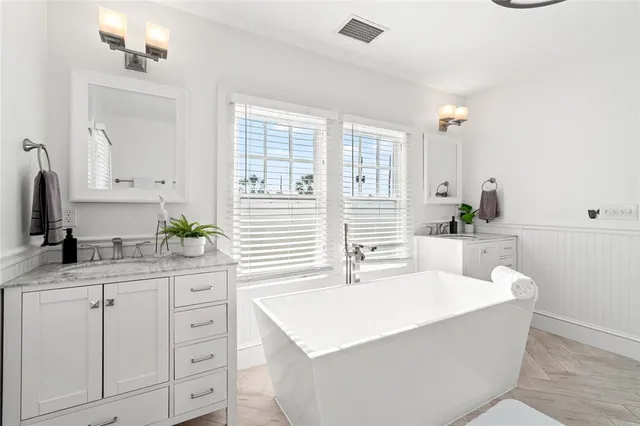 a kitchen with stainless steel appliances a refrigerator and a stove top oven