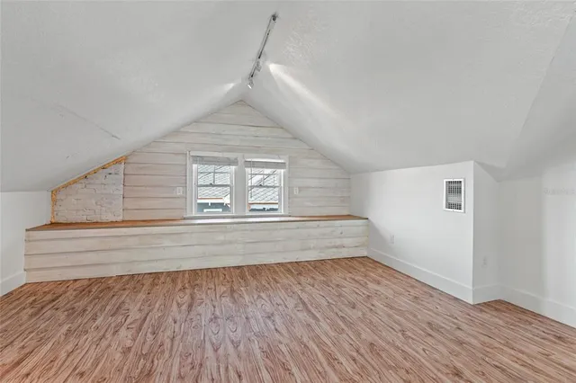 an aerial view of a house with a swimming pool