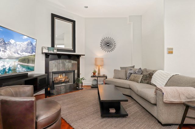 140 Ridge Avenue, Unit 2W Evanston, IL 60202 - Photo 12 of 36 a living room with furniture and a fireplace
