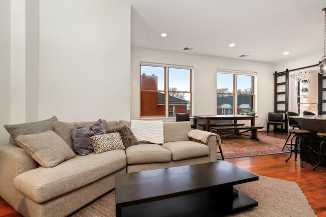 140 Ridge Avenue, Unit 2W Evanston, IL 60202 - Photo 14 of 36 a living room with furniture and a large window
