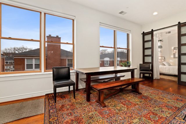 140 Ridge Avenue, Unit 2W Evanston, IL 60202 - Photo 16 of 36 a living room with furniture a rug and a floor to ceiling window