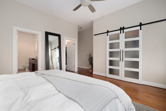 140 Ridge Avenue, Unit 2W Evanston, IL 60202 - Photo 19 of 36 a bedroom with a bed and a walk in closet