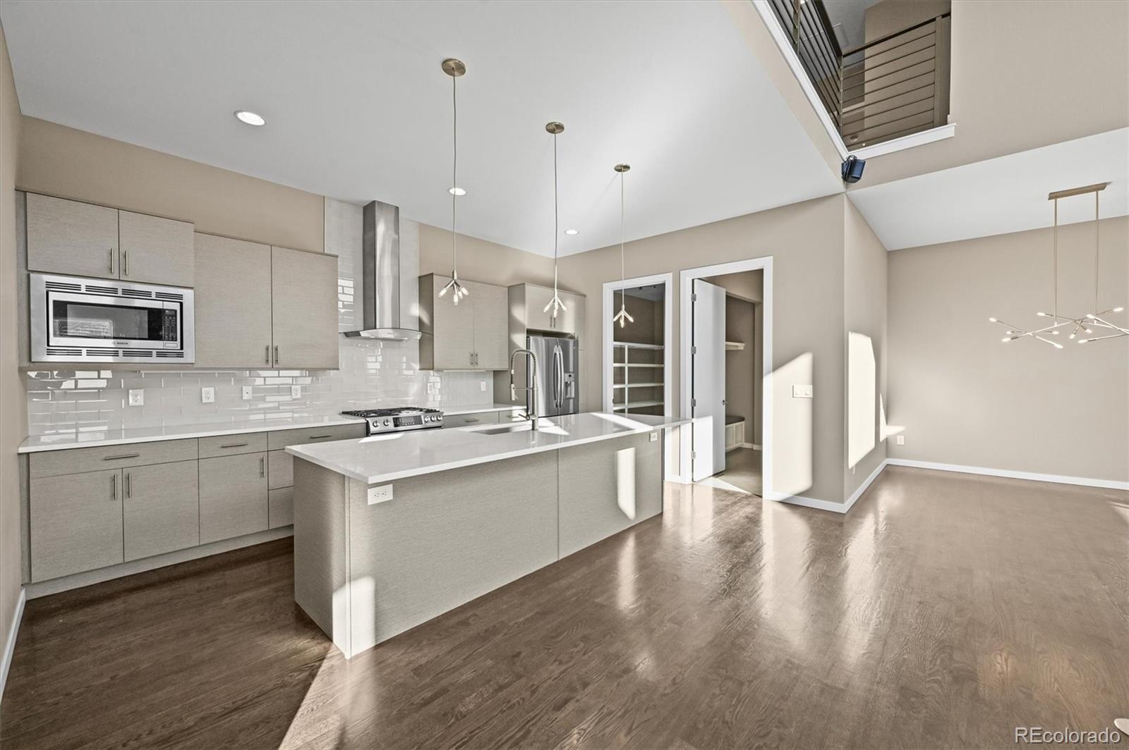 28424 Tepees Way Evergreen, CO 80439 - Photo 12 of 47 a kitchen with a stove a sink and a refrigerator