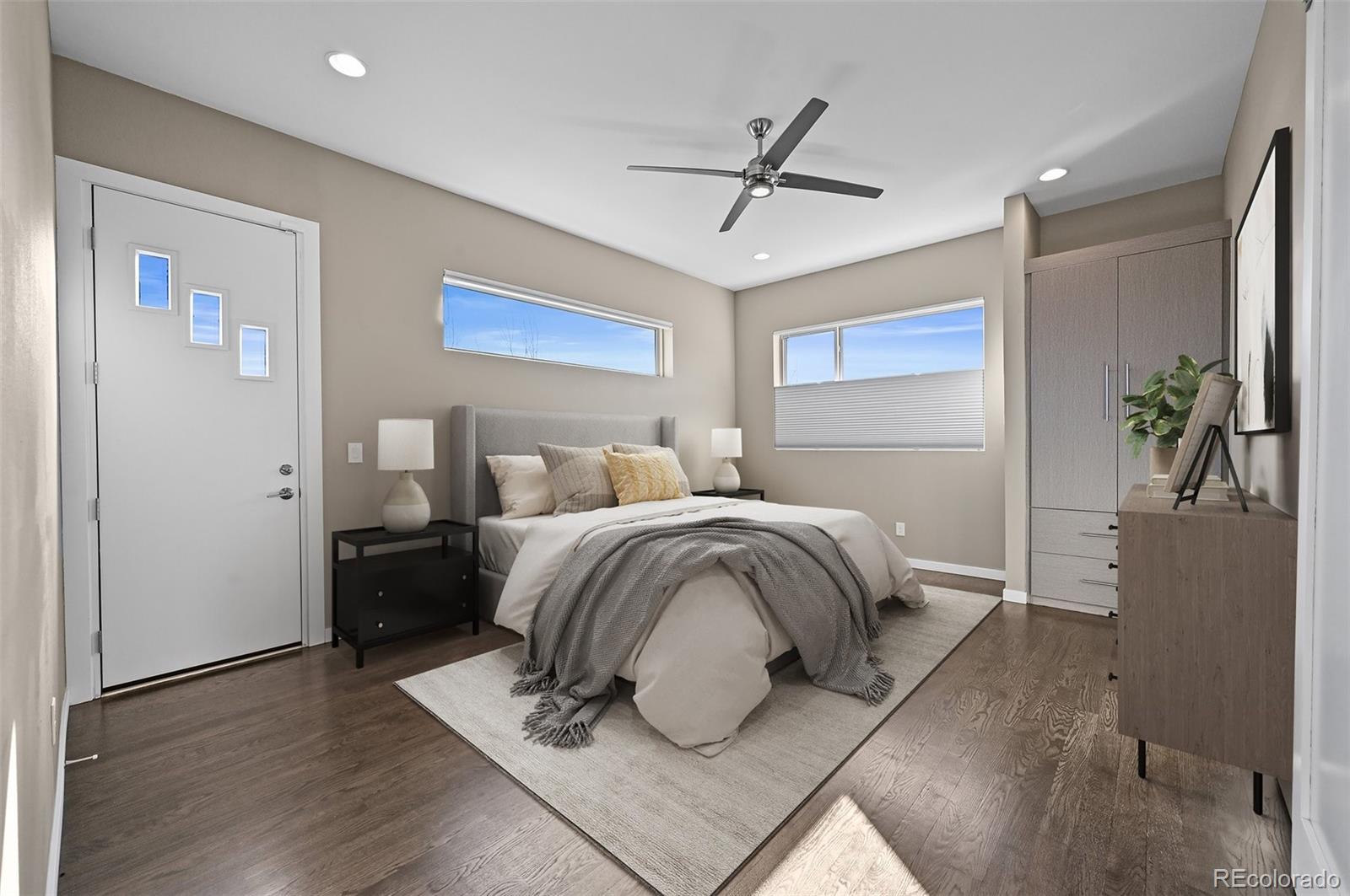 28424 Tepees Way Evergreen, CO 80439 - Photo 14 of 47 a bedroom with a bed and wooden floor