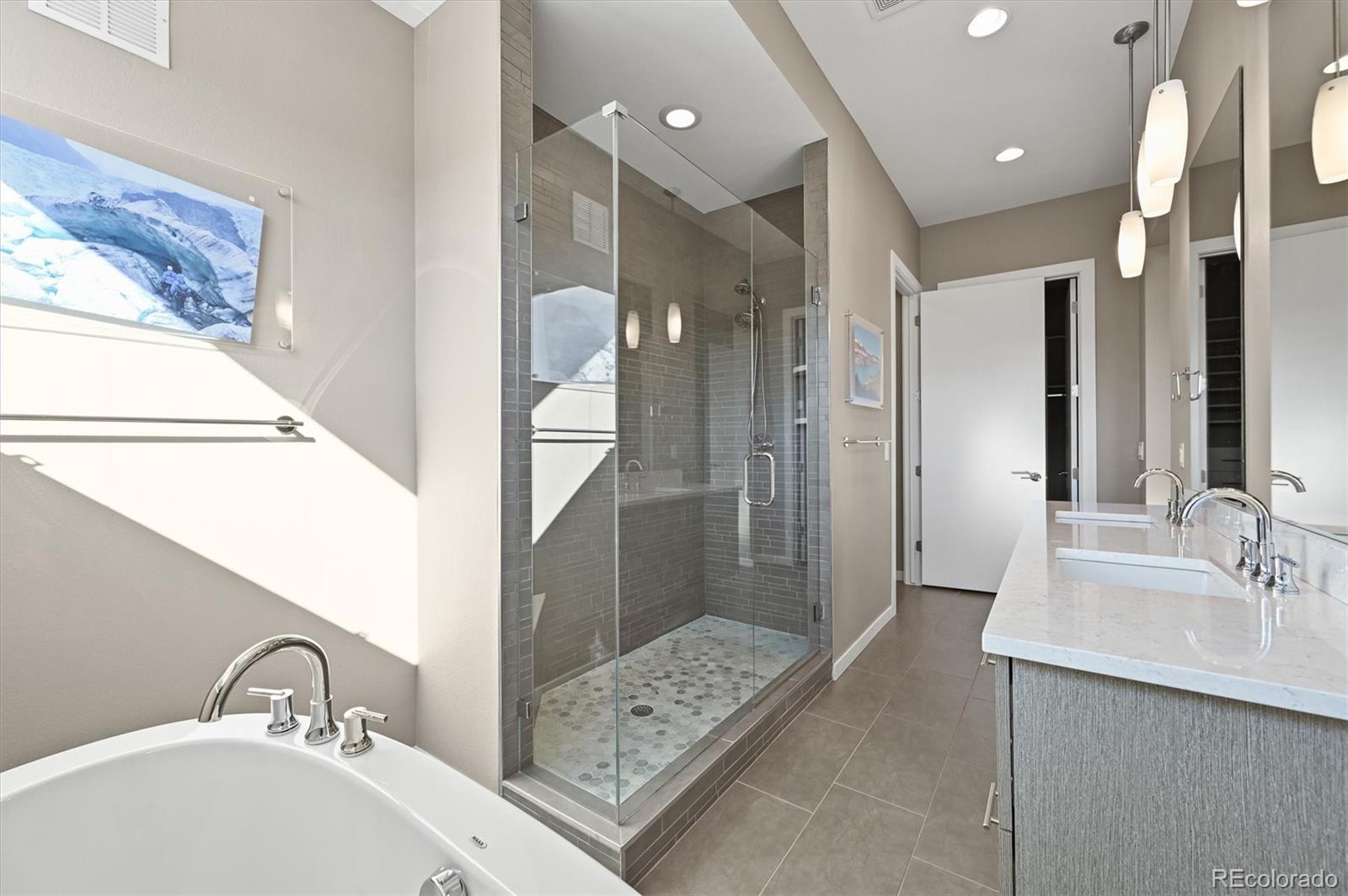 28424 Tepees Way Evergreen, CO 80439 - Photo 19 of 47 a bathroom with a sink and a mirror