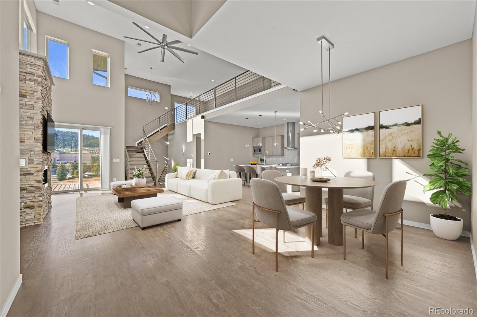 28424 Tepees Way Evergreen, CO 80439 - Photo 3 of 47 a living room with furniture and a chandelier