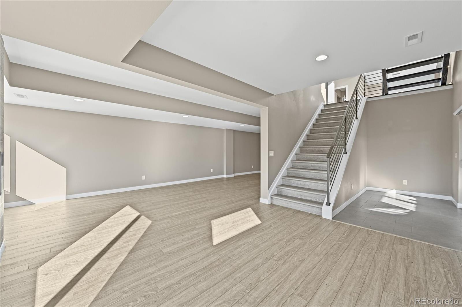 28424 Tepees Way Evergreen, CO 80439 - Photo 32 of 47 a view of entryway and hall with wooden floor