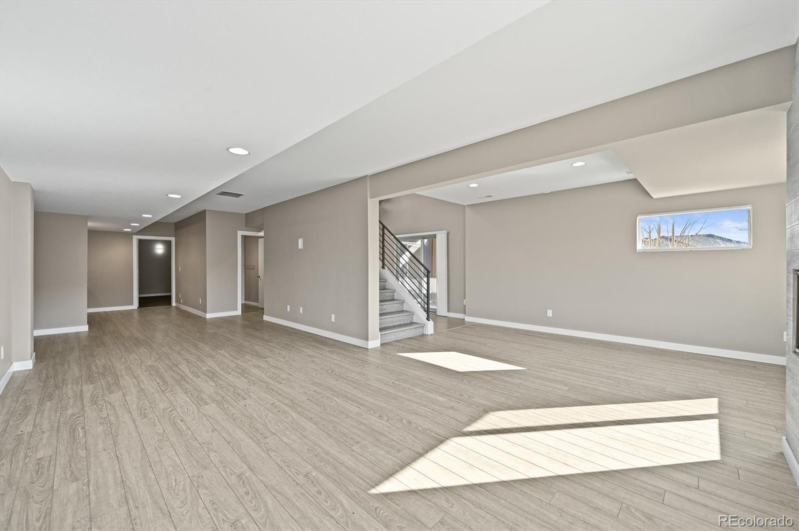 28424 Tepees Way Evergreen, CO 80439 - Photo 33 of 47 a view of an empty room with wooden floor and closet