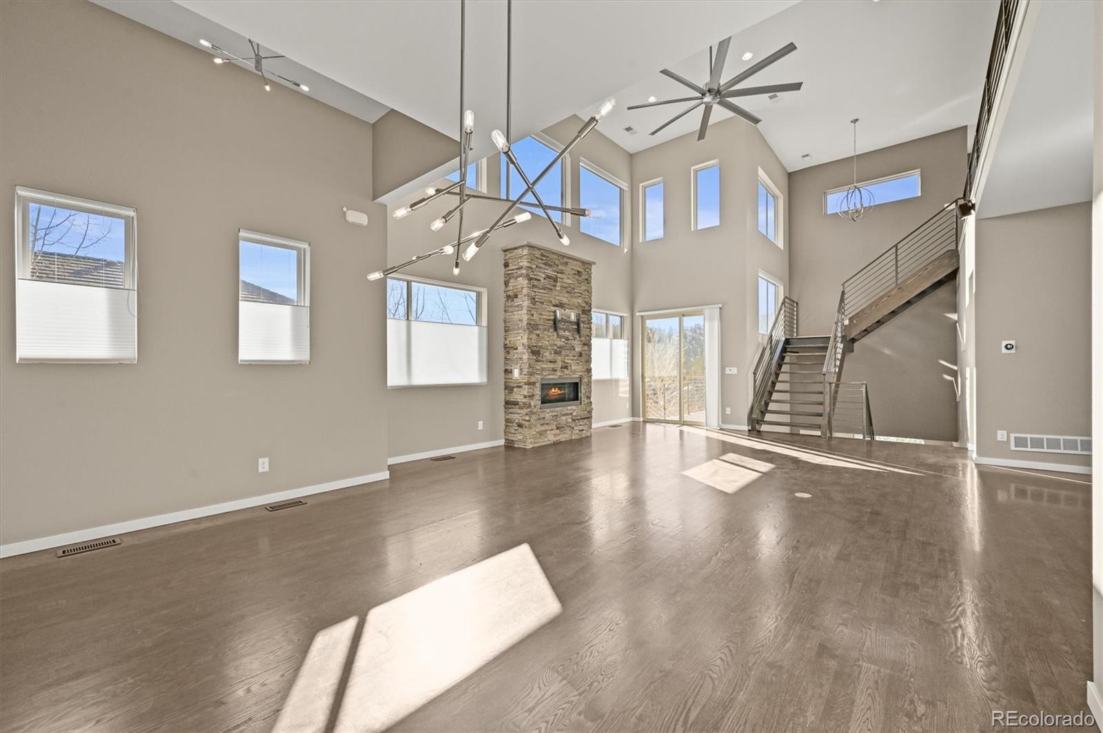 28424 Tepees Way Evergreen, CO 80439 - Photo 6 of 47 a view of a livingroom with a kitchen