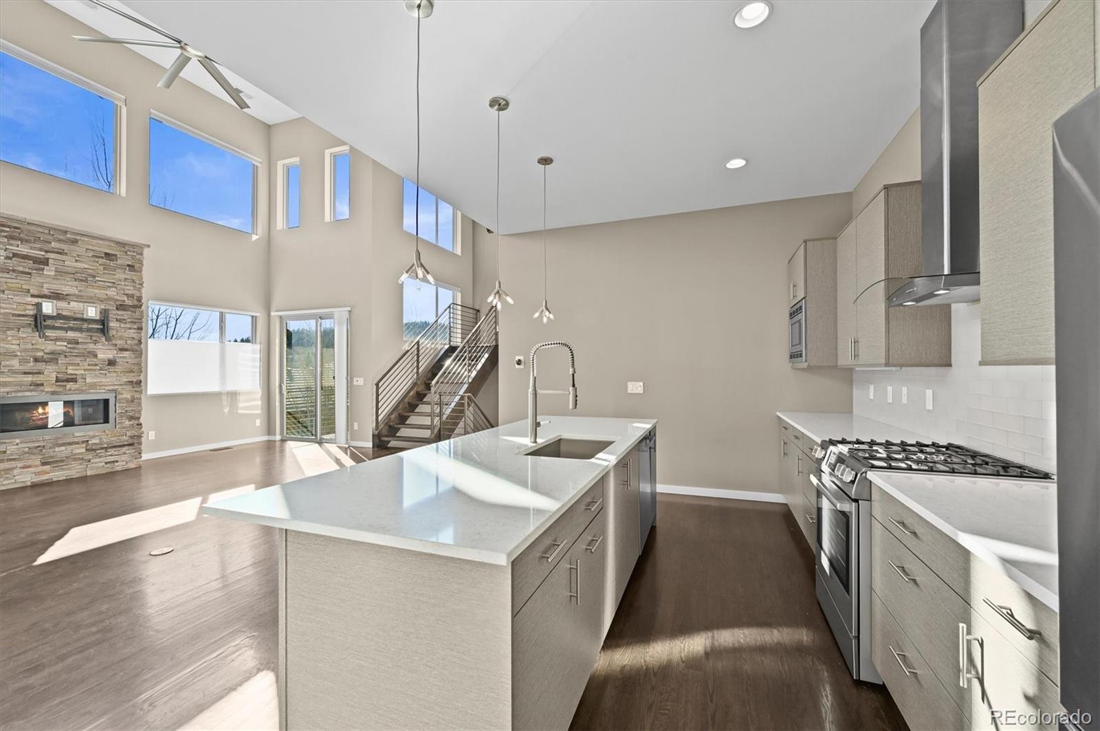 28424 Tepees Way Evergreen, CO 80439 - Photo 10 of 47 a kitchen that has a lot of cabinets in it