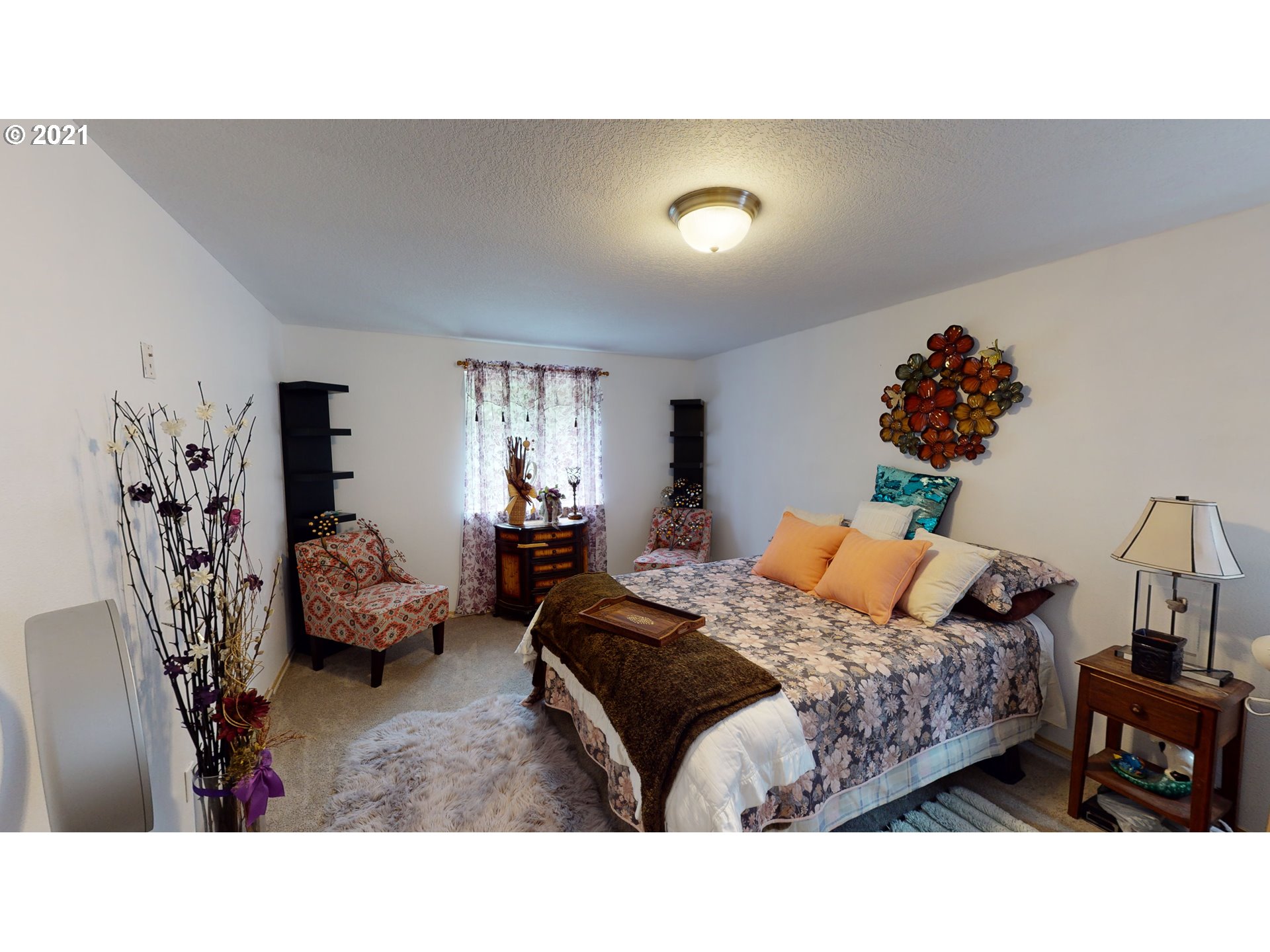 1803 Byron Creek Road Winston, OR 97496 - Photo 19 of 32 a bedroom with a bed and window