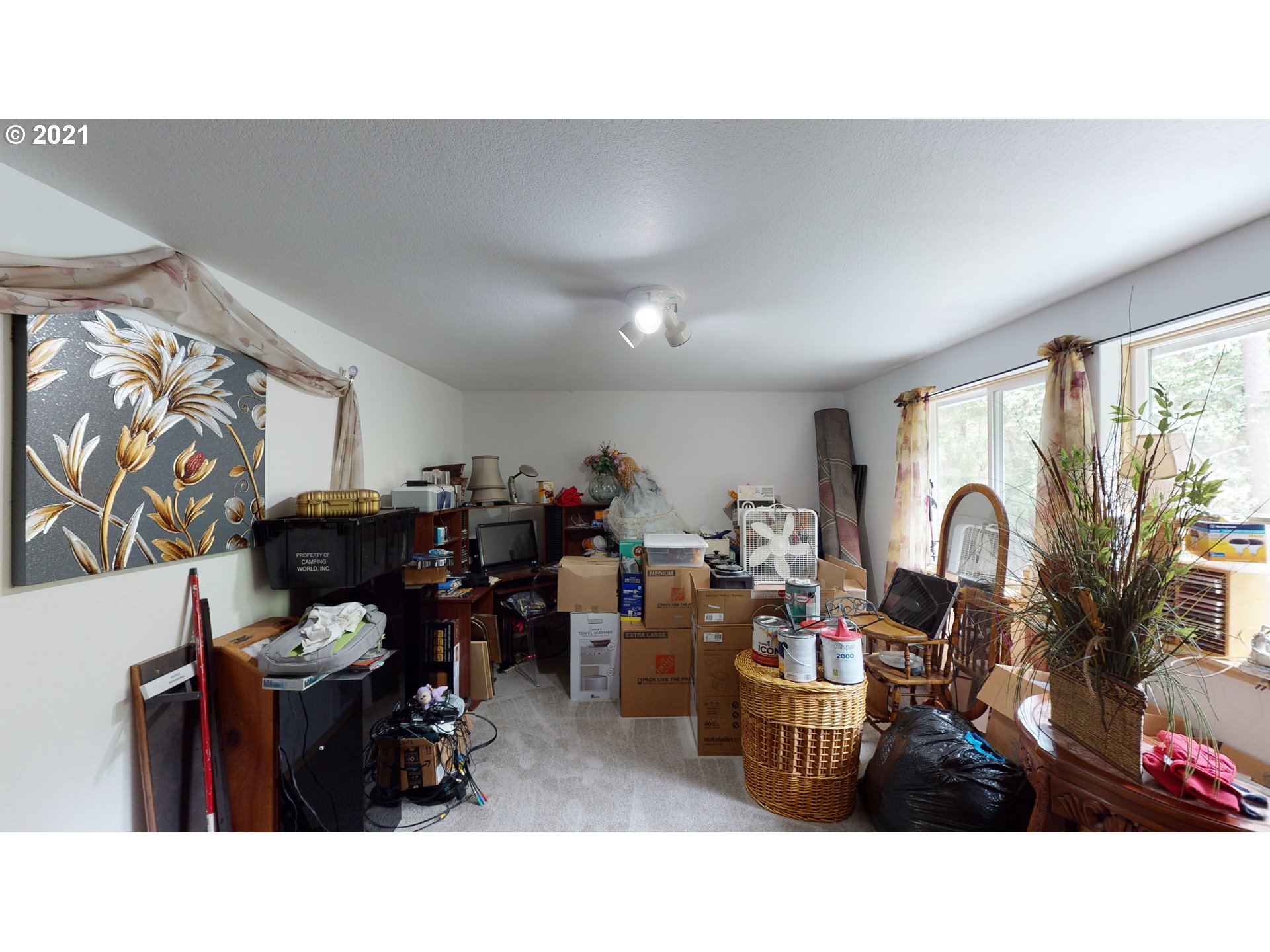 1803 Byron Creek Road Winston, OR 97496 - Photo 22 of 32 a living room with lots of furniture and clutter